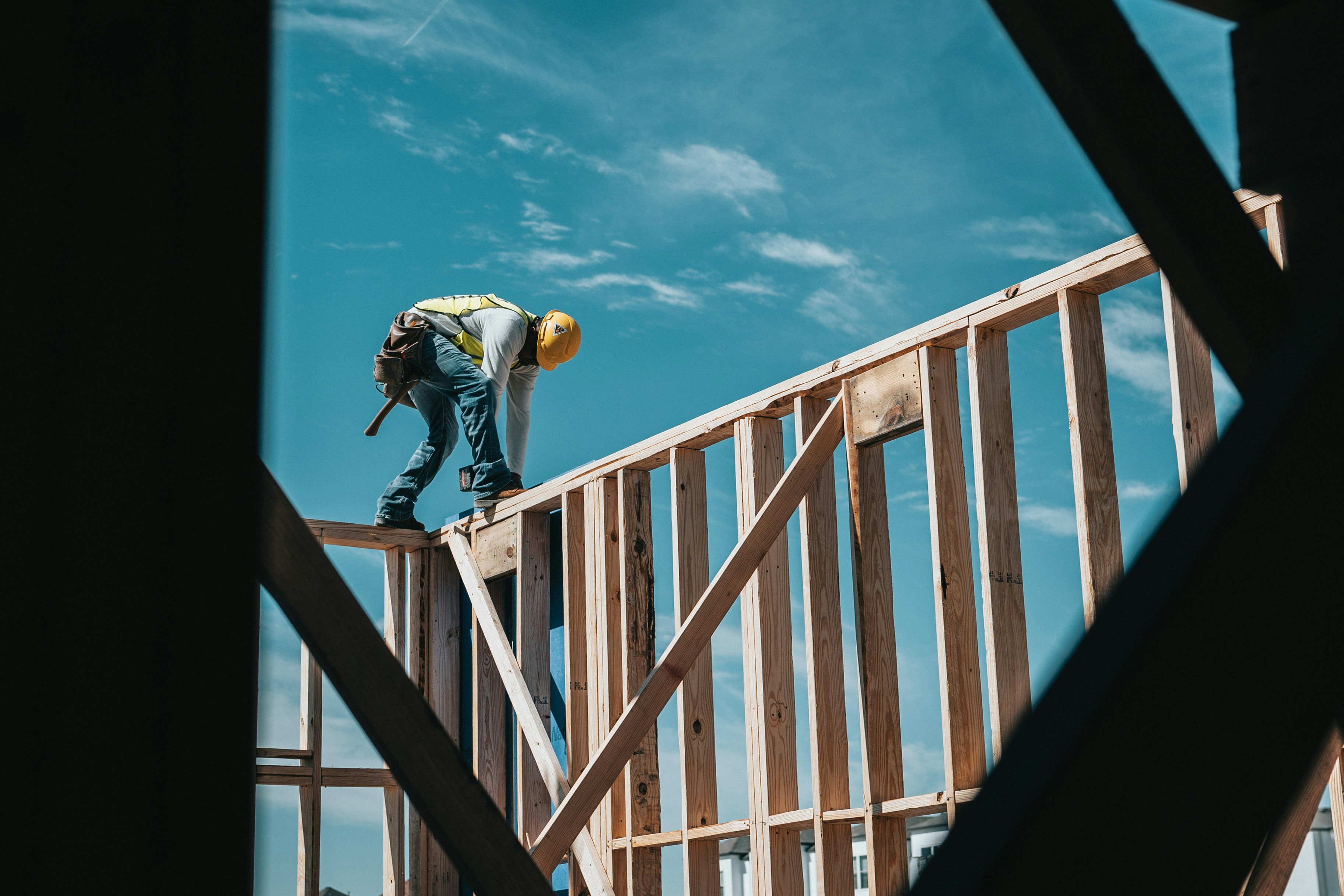 A construction worker hard at work on a building